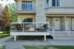 Multi-level exterior featuring light-toned horizontal siding - 