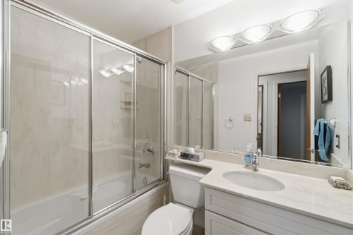 Bathroom with a full bathtub and sliding glass shower doors - 31 Gariepy Crescent, Edmonton, AB 