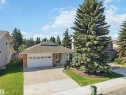 Single-story residence featuring a two-car garage, brick facade accents, and a front bay window - 31 Gariepy Crescent, Edmonton, AB 
