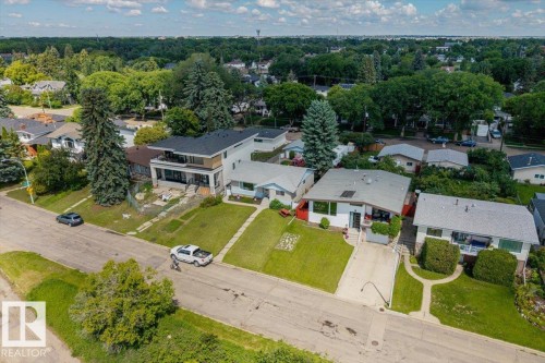 Aerial perspective showcasing a residential street with mature trees and established landscaping - 4622 Ada Boulevard, Edmonton, AB 