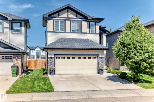 Two-story property featuring light siding and dark trim accents - 3672 Claxton Place, Edmonton, AB 