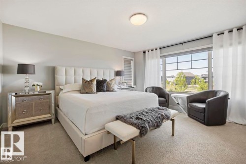 Spacious room featuring broadloom carpeting and light-toned walls - 1004 Huckell Pl Sw, Edmonton, AB - Indoor Photo Showing Bedroom