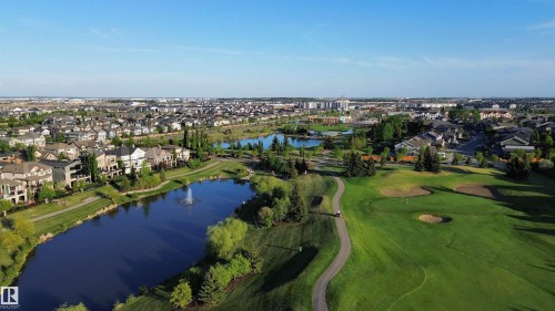 Expansive golf course setting featuring manicured greens and walking paths - 1004 Huckell Pl Sw, Edmonton, AB - Outdoor With View