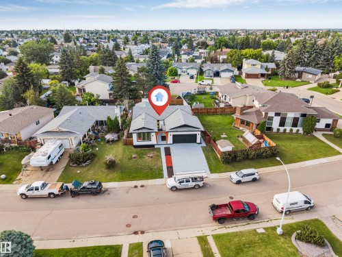Modern single-story residence with a dark asphalt shingle roof - 5512 150 Avenue, Edmonton, AB 