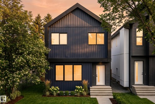 Modern architectural facade with dark vertical siding - 10815 152 Street, Edmonton, AB 
