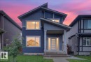 Modern two-story residence featuring a striking front entrance with a contemporary door and transom window - 18139 75 Street, Edmonton, AB 