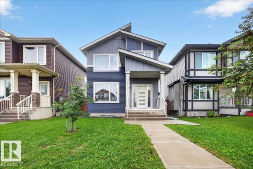 Contemporary two-story residence featuring a striking blue and gray facade - 18139 75 Street, Edmonton, AB 