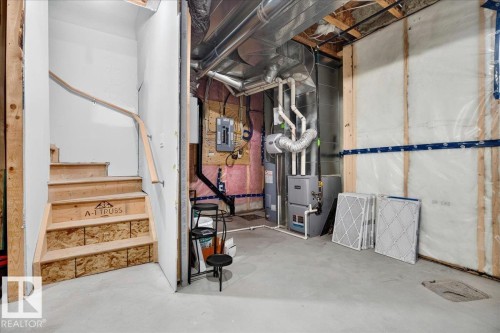Unfinished basement space with exposed framing and concrete flooring - 18139 75 Street, Edmonton, AB 