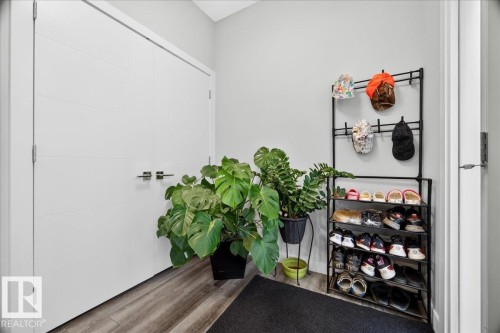 Light gray wall paint, wood-finish flooring, and white trim - 18139 75 Street, Edmonton, AB 