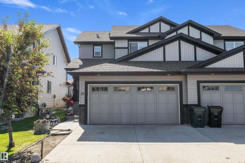 Modern facade featuring a combination of light gray siding, dark trim, and stone accents - 25 Halladay Boulevard, Spruce Grove, AB - Outdoor
