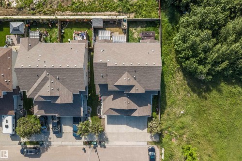 Aerial overview showcasing a property with a multi-gabled roofline and an attached garage - 25 Halladay Boulevard, Spruce Grove, AB - Outdoor