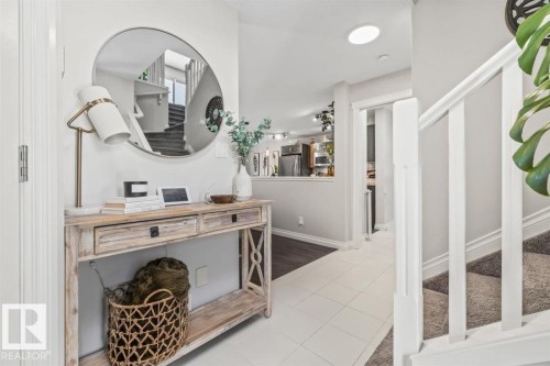 Entry foyer featuring white tile flooring, recessed lighting, and a skylight - 14 Edinburgh Crt N, St. Albert, AB 