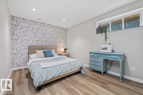 Bedroom featuring wood-finish flooring, recessed lighting, and a window - 14 Edinburgh Crt N, St. Albert, AB 