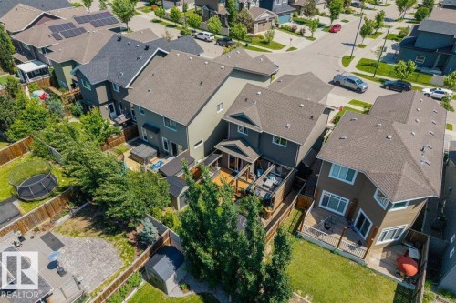 Contemporary residential property featuring a multi-level deck, fenced backyard with green space, and a detached shed - 14 Edinburgh Crt N, St. Albert, AB 