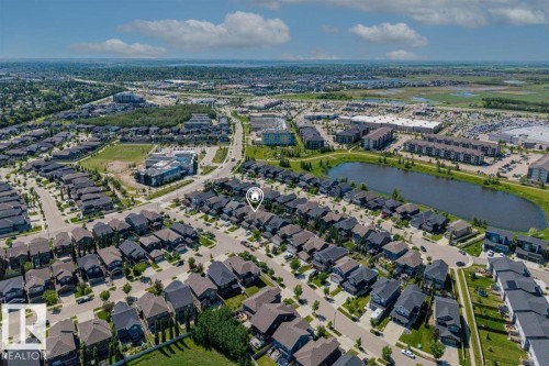 Aerial perspective showcasing a residential neighborhood with dark-roofed homes - 14 Edinburgh Crt N, St. Albert, AB 