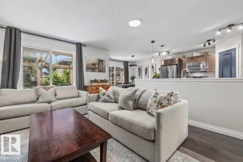 Open-concept living area with dark wood-finish flooring - 14 Edinburgh Crt N, St. Albert, AB 