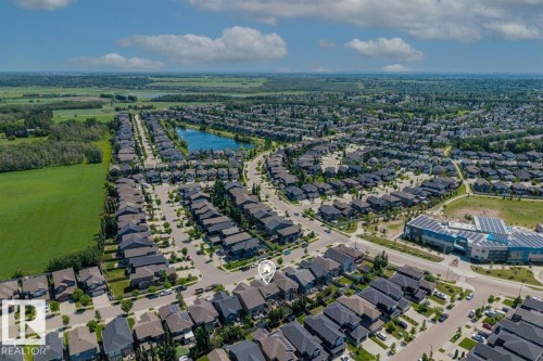 Aerial perspective showcasing a residential neighborhood with dark-roofed homes - 14 Edinburgh Crt N, St. Albert, AB 
