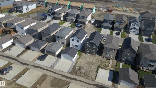 Newly constructed residential properties featuring contemporary designs and diverse facade finishes - 33 Eton Link, Spruce Grove, AB 