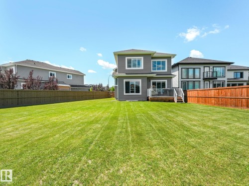 Expansive green lawn with a privacy fence - 5411 66 Street, Beaumont, AB 