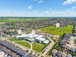 Aerial perspective showcasing a residential community with abundant green spaces - 