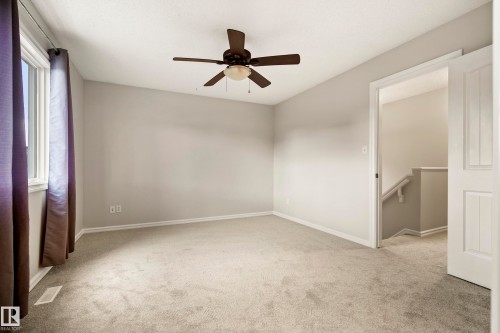 Neutral-toned room featuring light gray walls and plush carpeting - 2369 27 Avenue, Edmonton, AB 