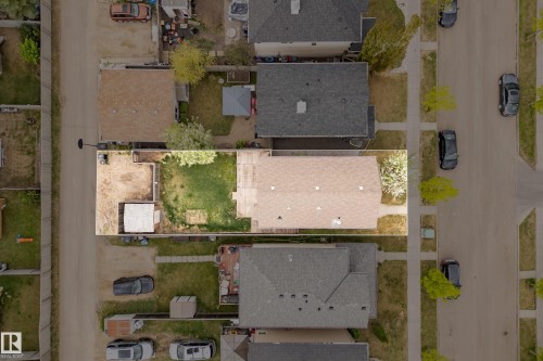 Aerial perspective highlighting a property with a distinct combination of hardscaping and green space - 2369 27 Avenue, Edmonton, AB 