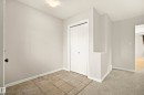 Entryway featuring neutral wall paint, tile flooring, and a flush mount ceiling light - 2369 27 Avenue, Edmonton, AB 