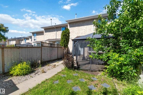 Private backyard featuring a paved patio and a screened gazebo - 14121 23 Street, Edmonton, AB 