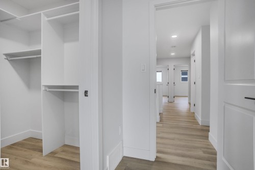 Walk-in closet with built-in shelving and hanging rods - 1915 164 Street, Edmonton, AB 