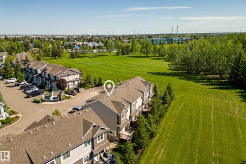 End-unit townhome featuring a private balcony and a detached garage - 11 4205 30 Street, Edmonton, AB 