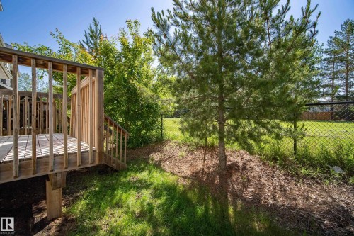Wood deck with baluster railing and steps - 11 4205 30 Street, Edmonton, AB 