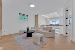 Open concept space with herringbone wood-finish flooring - 