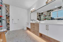 Double vanity with white vessel sinks and undermount lighting - 