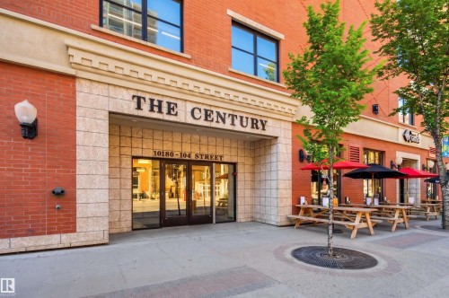 Brick and stone facade building with large glass entry doors - 1103 10180 104 Street, Edmonton, AB 