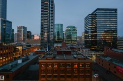 Expansive urban panorama featuring a diverse skyline with residential and commercial towers - 