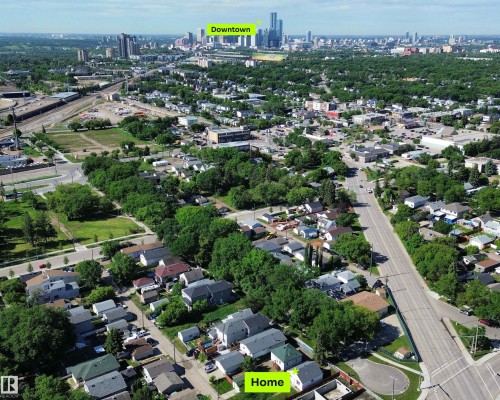 Aerial perspective showcasing the property within a residential neighborhood with mature trees - 11941 78 Street, Edmonton, AB 
