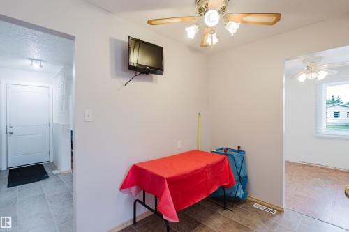 Interior space featuring neutral wall paint and wood-finish flooring - 212 Homestead Crescent, Edmonton, AB 