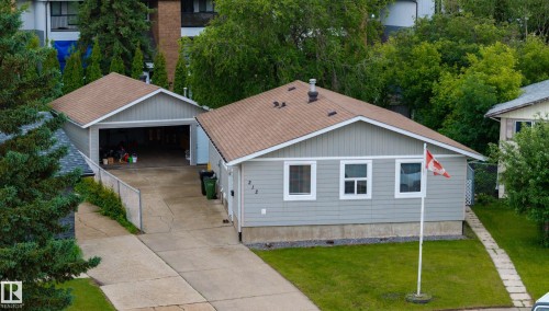 Light gray siding home with white trim windows and a brown shingle roof - 212 Homestead Crescent, Edmonton, AB 