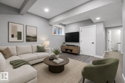 Spacious living area featuring light gray walls, recessed lighting, wood-finish flooring, a contemporary window, and a white interior door with black hardware - 