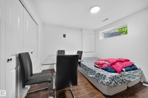 Room featuring white walls, wood-finish flooring, and a recessed window - 4 4350 23 Street, Edmonton, AB 