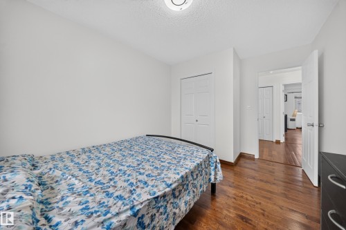 Hardwood-style flooring throughout this room and extending into the hallway - 4 4350 23 Street, Edmonton, AB 