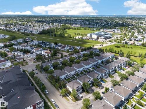 Expansive aerial perspective showcasing a residential area with a mix of single-family homes and townhouses - 4 4350 23 Street, Edmonton, AB 
