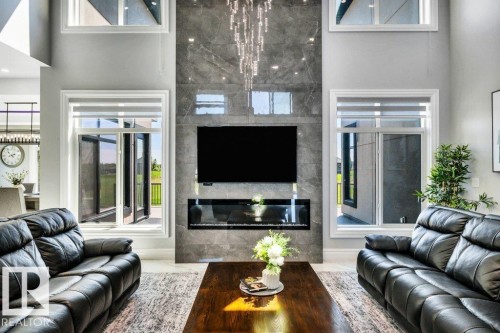 #50 50532 Range Road 234, Rural Leduc County, AB - Indoor Photo Showing Living Room With Fireplace