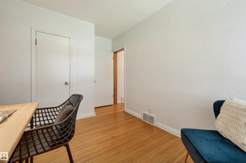 Natural wood flooring extending throughout the space - 11619 122 Street, Edmonton, AB 