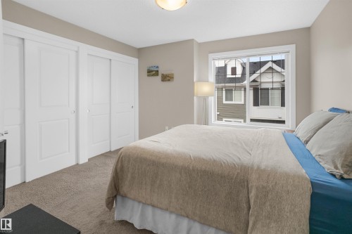 Bedroom featuring neutral-toned walls and carpet flooring - 13 2803 James Mowatt Trail, Edmonton, AB 