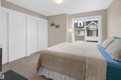 Bedroom featuring neutral-toned walls and carpet flooring - 