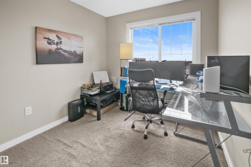 Neutral wall paint with white baseboards and carpeted flooring - 13 2803 James Mowatt Trail, Edmonton, AB 