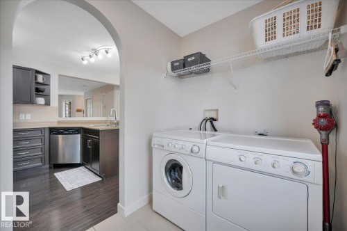 Conveniently located by the back door - 4865 Terwillegar Common, Edmonton, AB - Indoor Photo Showing Laundry Room