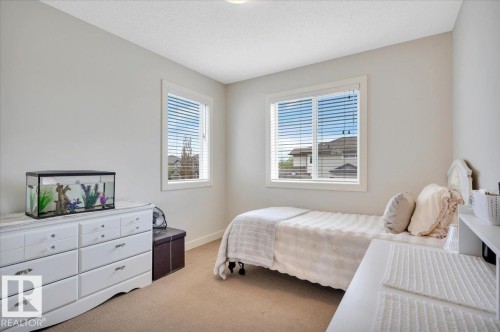 Carpeted room featuring two windows - 4865 Terwillegar Common, Edmonton, AB - Indoor Photo Showing Bedroom