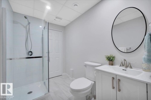 Bathroom featuring a glass-enclosed shower with white tiled walls - 4865 Terwillegar Common, Edmonton, AB - Indoor Photo Showing Bathroom